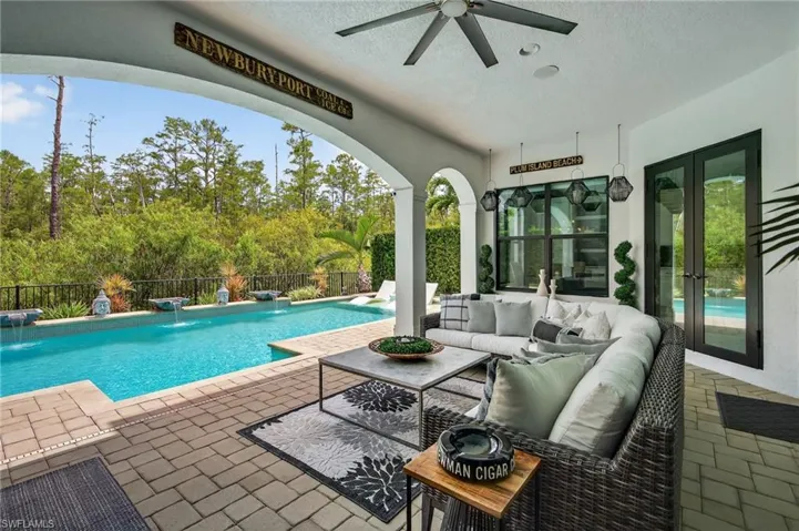 View of swimming pool featuring a patio, an outdoor living space, a ceiling fan, and french doors