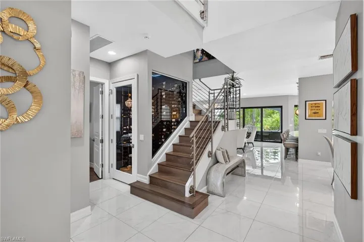 Stairs featuring marble finish flooring