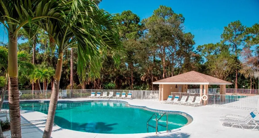 View of swimming pool with a gazebo and a patio area