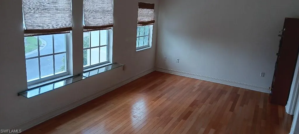 Empty room featuring hardwood / wood-style floors
