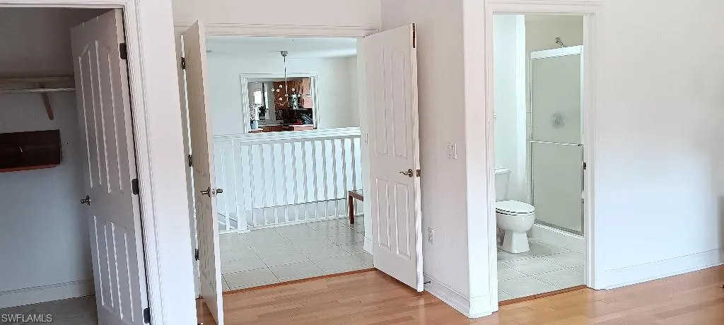 Hallway featuring light tile patterned flooring