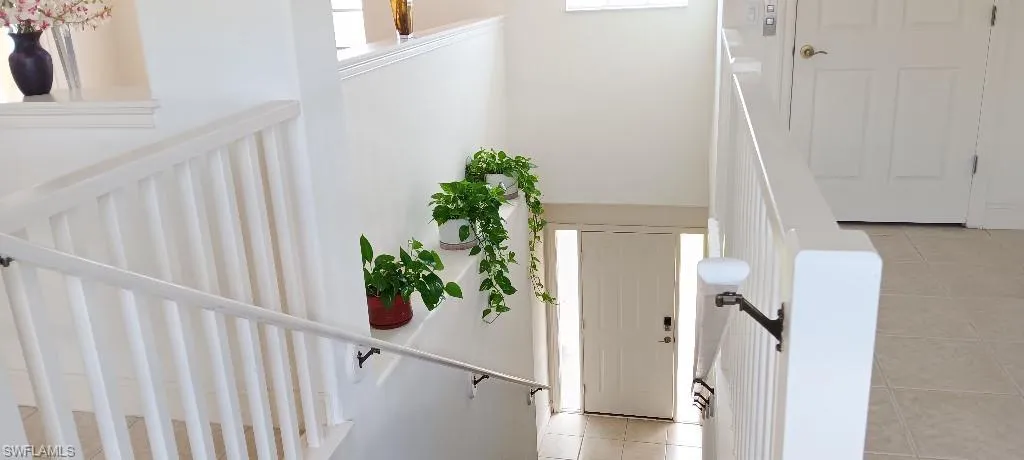 Staircase with tile patterned floors