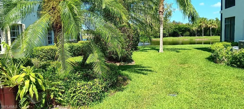 View of yard with a water view