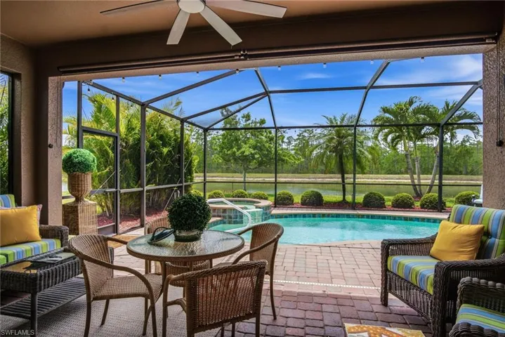 Enjoy covered lounging space, and picturesque lake and preserve views - creating the perfect private backdrop.