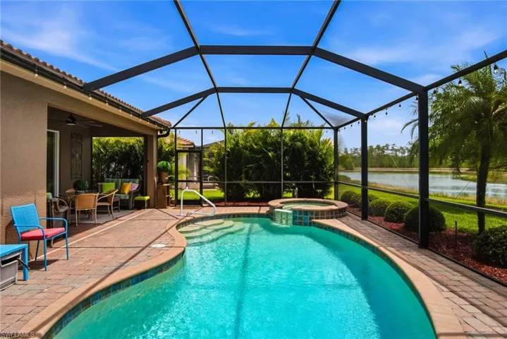Step outside to the RESORT-STYLE OUTDOOR LIVING AREA where you will find a HEATED POOL AND SPA with AquaLink control system.