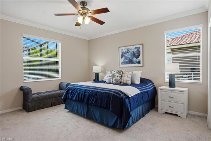 The primary suite features dual closets and an ensuite bath with dual vanities, separate soaking tub, and glass-enclosed shower.