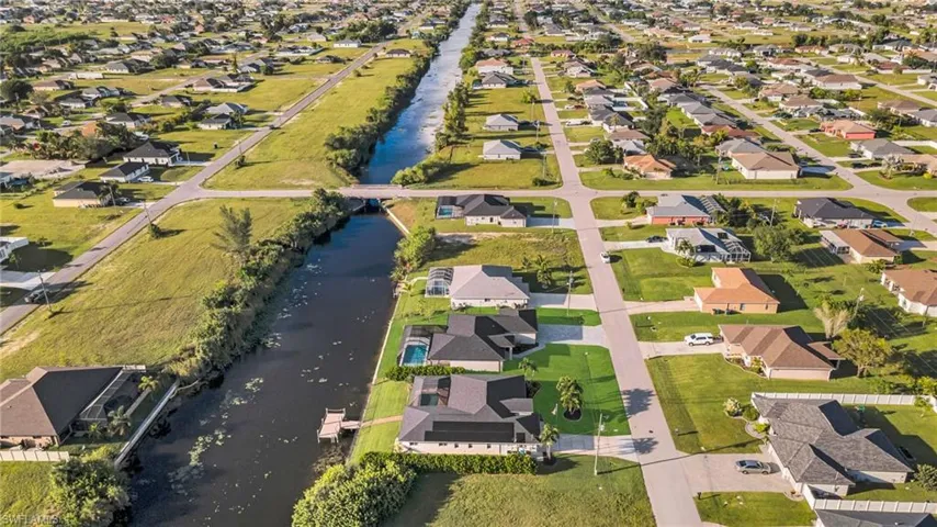 View of property location with nearby suburban area