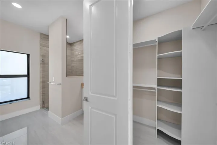 Full bath featuring a shower stall and recessed lighting
