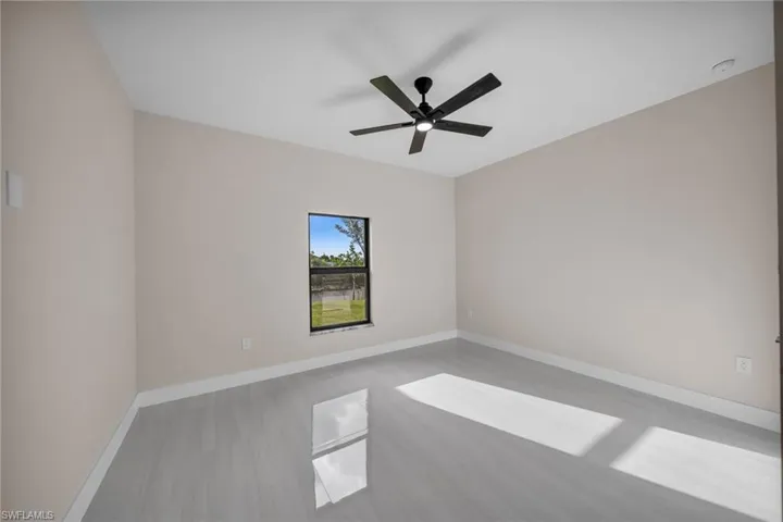 Spare room with ceiling fan and wood finished floors