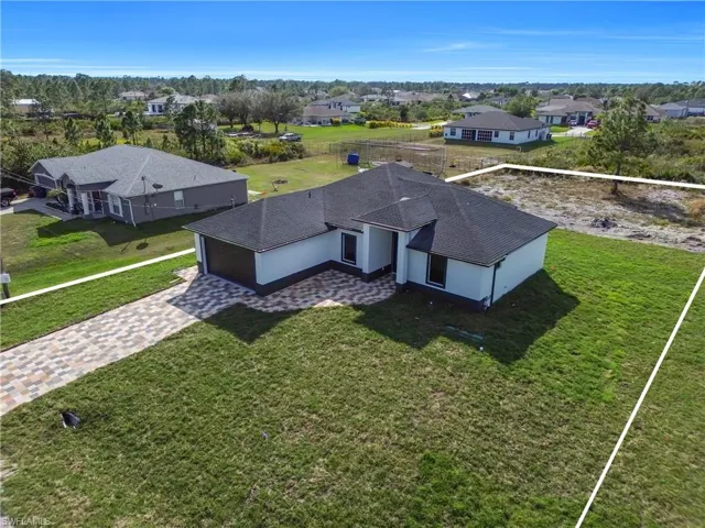 Aerial view of residential area with property boundaries highlighted