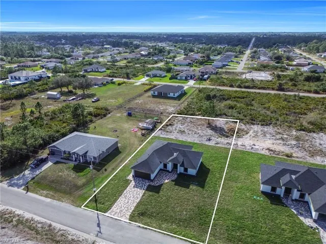 Aerial perspective of suburban area with property parcel outlined