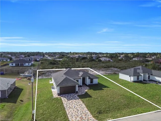 Aerial view of residential area with property boundaries highlighted