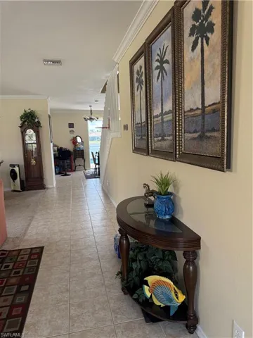 View of pool featuring a sunroom, a lanai, a pool with connected hot tub, a patio, and a residential view