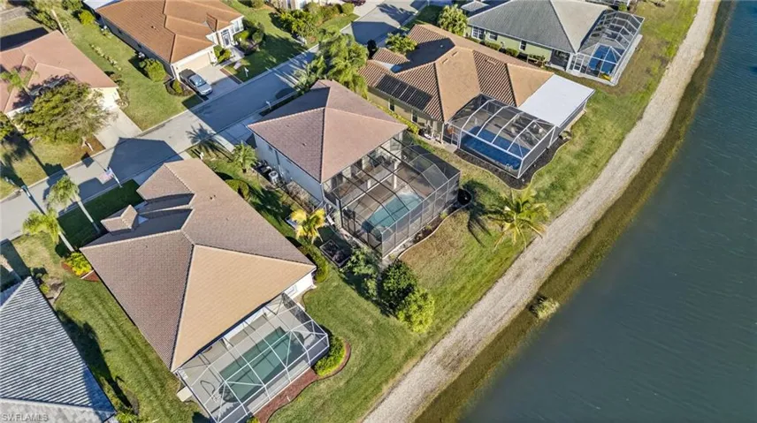 Aerial perspective of suburban area with a nearby body of water