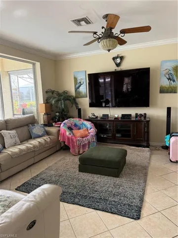 Full bath with vanity, a garden tub, light tile patterned floors, and plenty of natural light