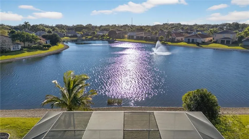 Aerial perspective of suburban area with a nearby body of water