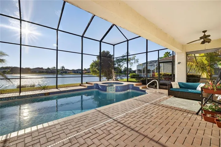 Aerial perspective of suburban area with a nearby body of water