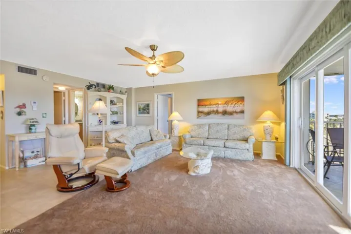 Living area featuring ceiling fan