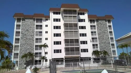 View of apartment building / complex with a community pool
