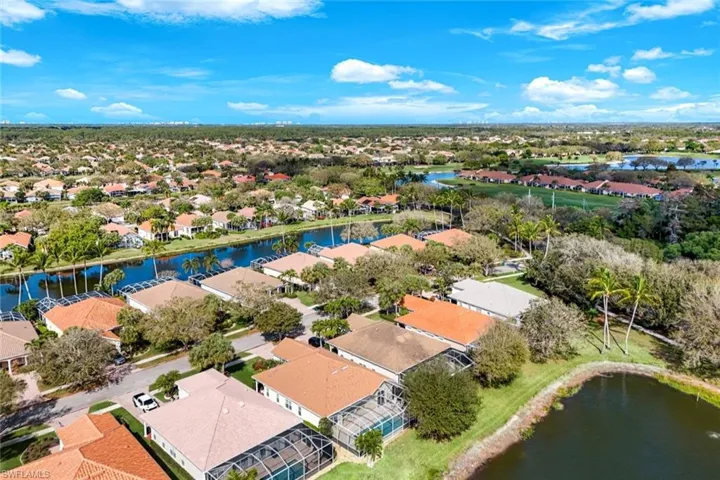 Aerial view of residential area featuring a large body of water