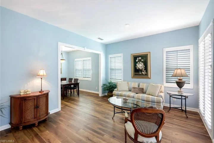 Living area featuring baseboards and hardwood / wood-style flooring