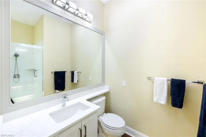 Full bathroom featuring vanity and a stall shower