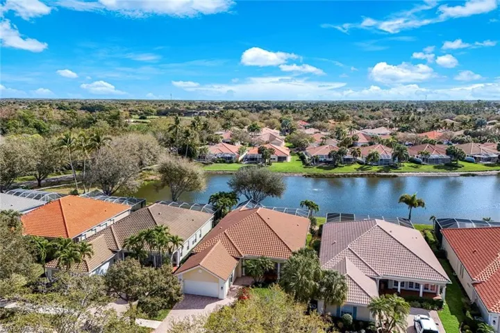 Aerial perspective of suburban area with a large body of water