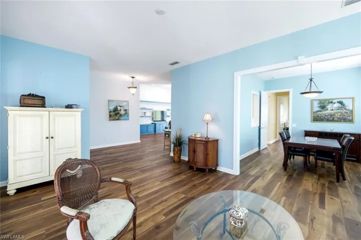Living area featuring dark wood-style floors
