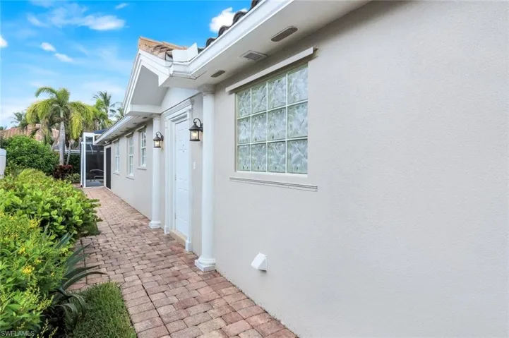 View of side of home with stucco siding