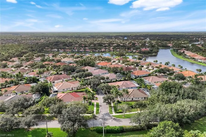 Aerial overview of property's location featuring nearby suburban area and a large body of water