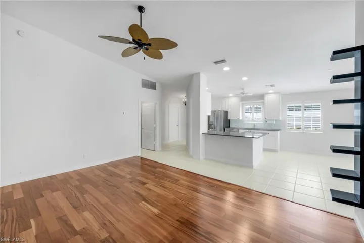 Unfurnished living room with a ceiling fan, light wood-style floors, and recessed lighting