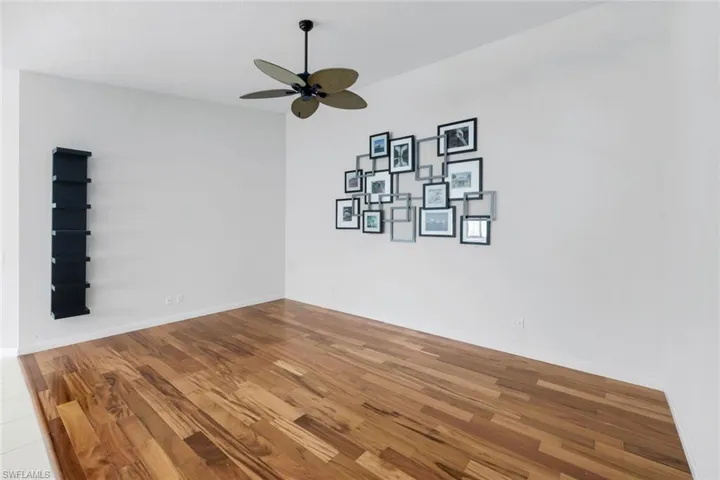 Spare room featuring wood finished floors and ceiling fan