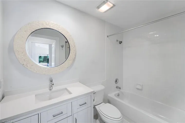 Bathroom with shower / tub combination and vanity