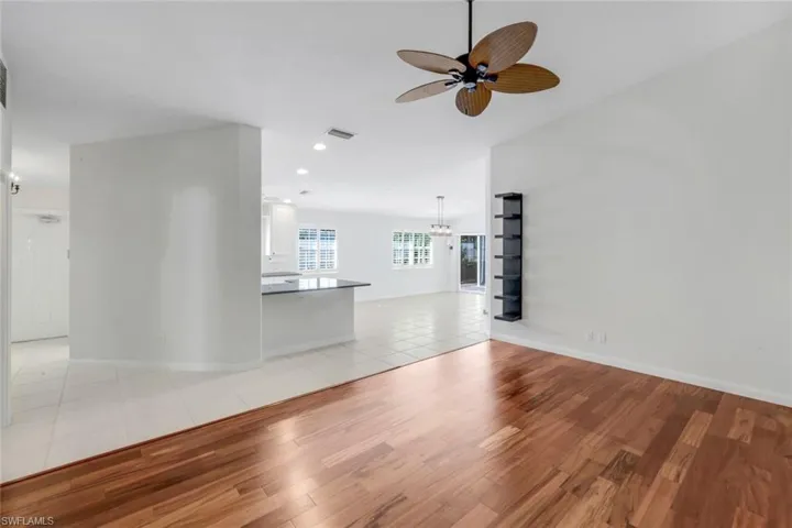 Unfurnished living room with light tile patterned floors, ceiling fan, and recessed lighting
