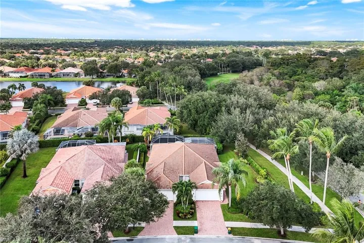 Aerial perspective of suburban area with a nearby body of water