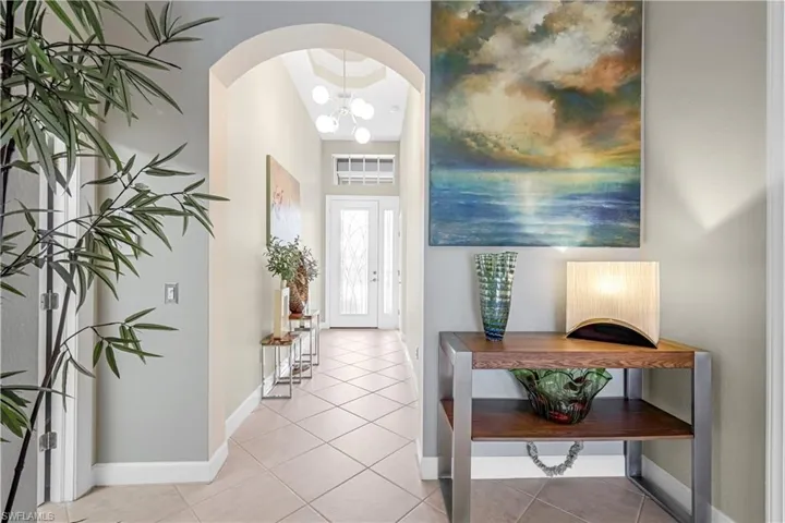 Lavish glass entry door beckons you to enter into this tranquil home. Double tray ceilings and custom lighting welcomes you home!