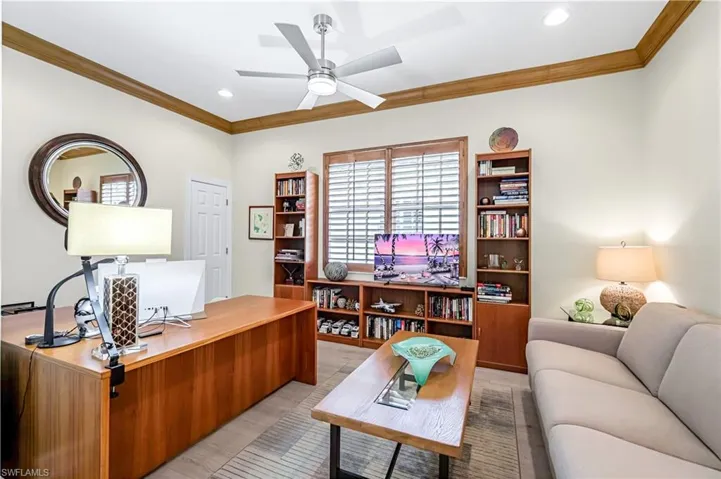This is the 3rd bedroom with a full closet.  It also serves as an office/den. Crown molding and plantation shutters.