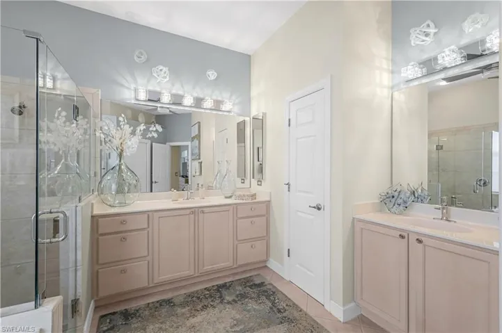 New lighting, 2 separate comfort height vanities. Private water closet.