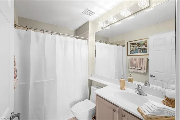 2nd full bath has a shower/tub combination single vanity. New lighting.