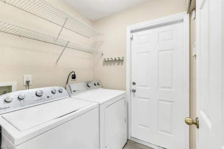 Washroom featuring separate washer and dryer