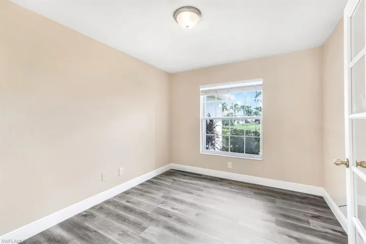 Unfurnished room with hardwood / wood-style floors