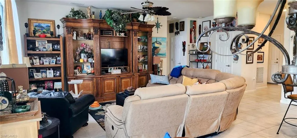Tiled living room with ceiling fan