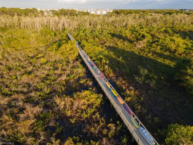 Bay Forest's boardwalk extends through a preserve to the back bay behind Barefoot Beach. Kayak storage is available for residents to reserve.