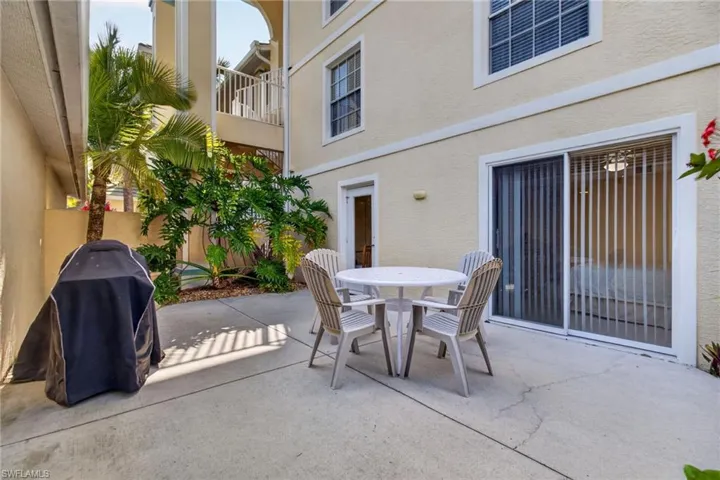 This rare and rarely available "garden unit" features a large outdoor patio area with landscaping and a gas grill.