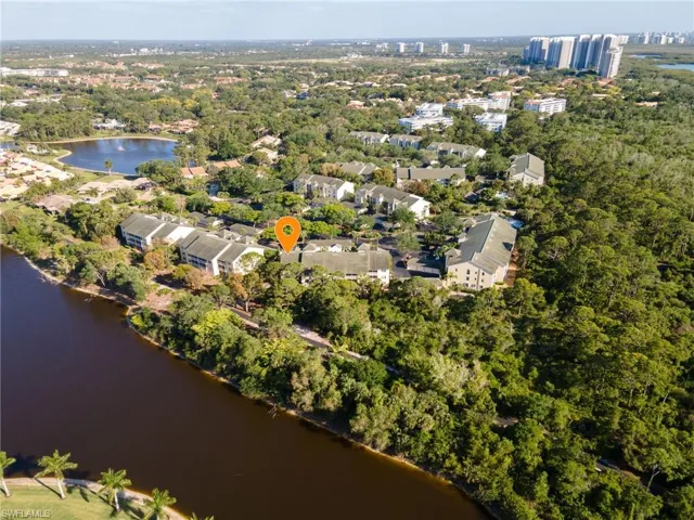 Aerial view of the property looking southeast, with Bay Forest's trail seen between the unit building and the lake.