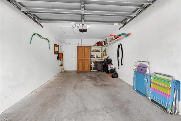 The single-car garage has a back door that goes directly to the private patio. Extra length provides storage space, as does the lighted attic.