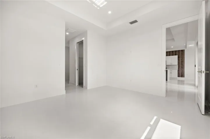 Unfurnished room featuring recessed lighting and light tile patterned flooring