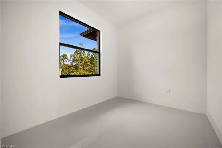 Unfurnished room with baseboards