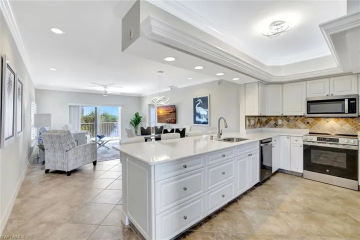 Open kitchen overlooking dining/living area and view of Smokehouse Bay
