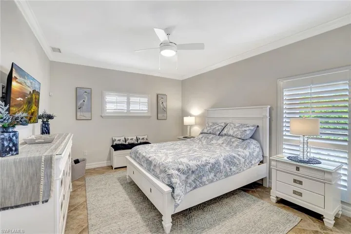 Large guest bedroom with ample natural light